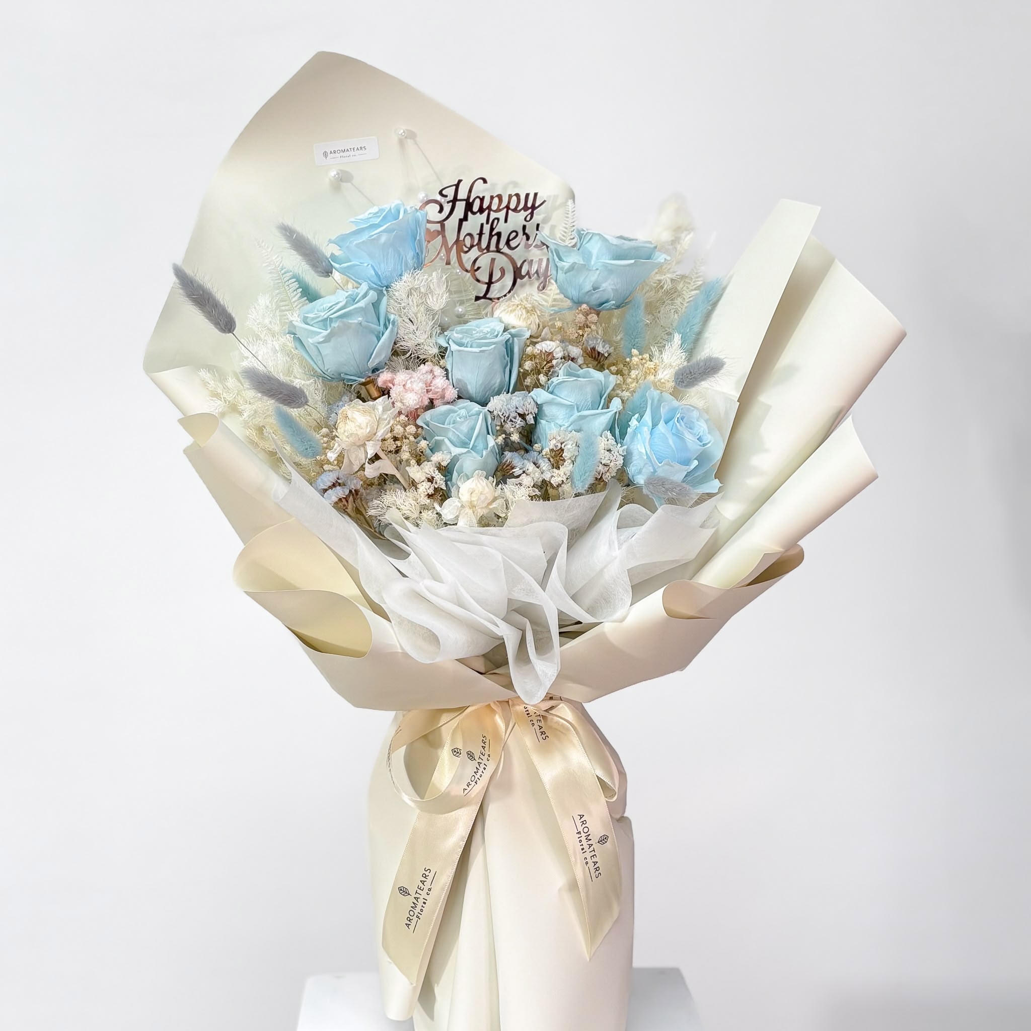 Elegant blue preserved everlasting rose bouquet from Aromatears florist in Vancouver, perfect for lasting floral gifts
with Happy Mother's Day pick