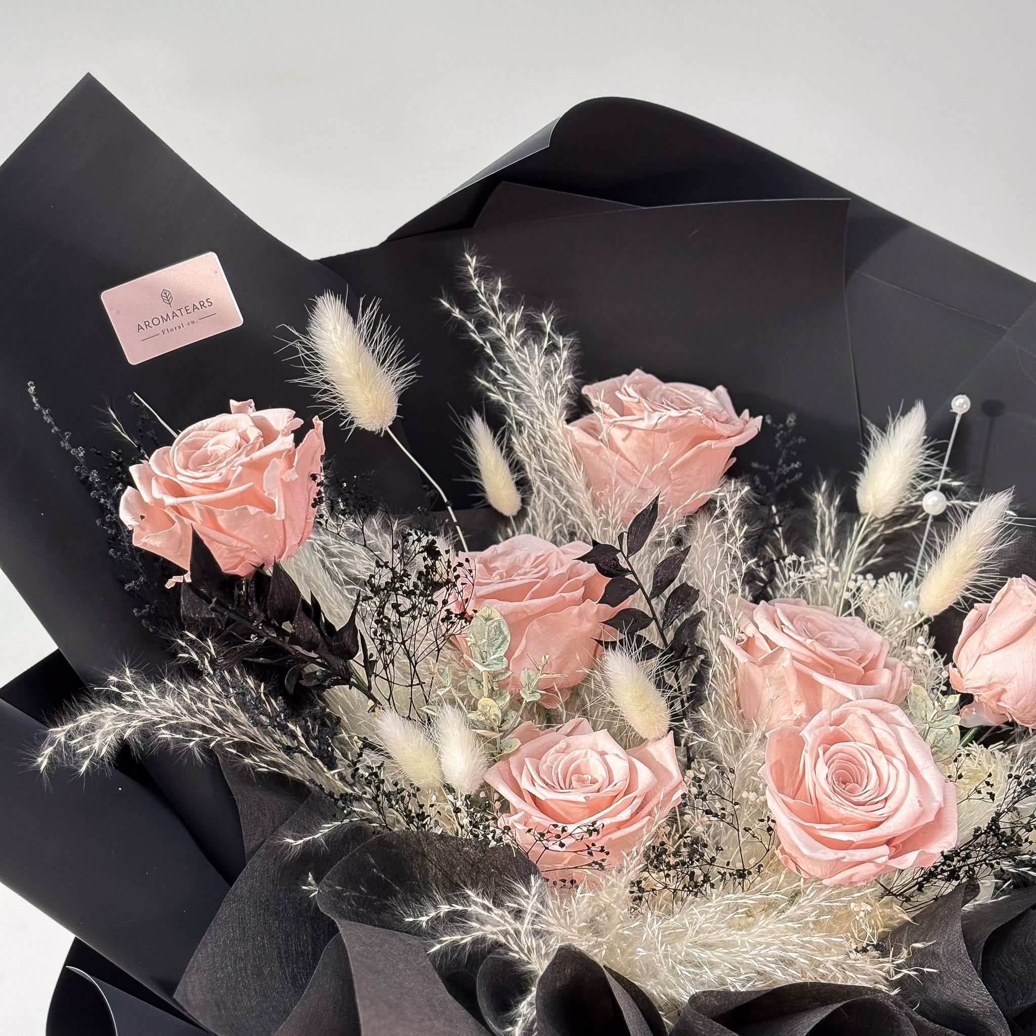 Closeup showing the exquisite texture and rich nude pink colour of the preserved roses in the Designer's Choice Bouquet, a unique and enduring gift.