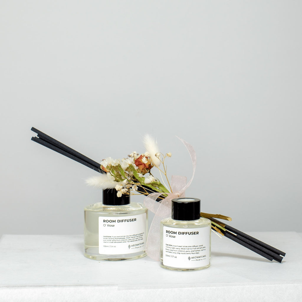 Aromatears Signature Scent Reed Diffuser 50ml and 100ml - Front view of glass bottle with reeds, providing long-lasting home fragrance handcrafted in Vancouver.